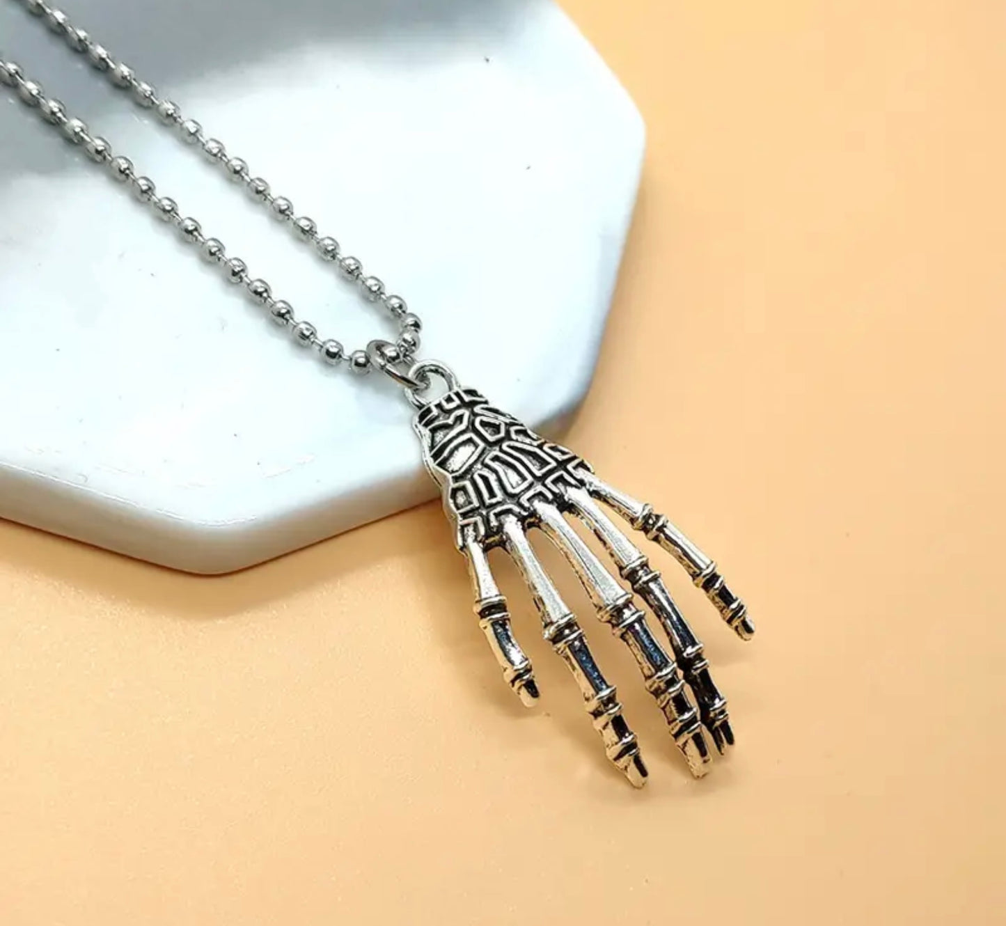 Skeleton hand necklace